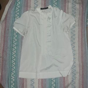 White short-sleeve ruffled blouse